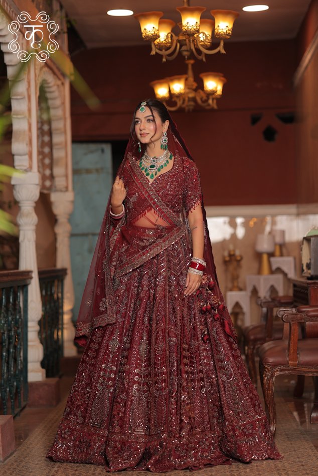 Bride wearing a maroon embellished bridal lehenga with dupatta – Wedding Collection