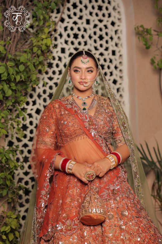Designer rust orange bridal lehenga featuring intricate embellishments