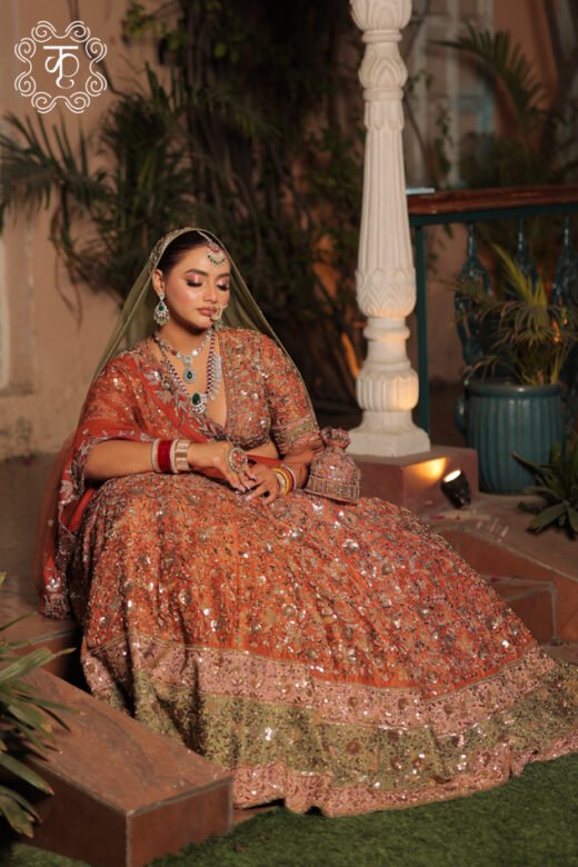 Rust orange embellished bridal lehenga with elegant olive green dupatta