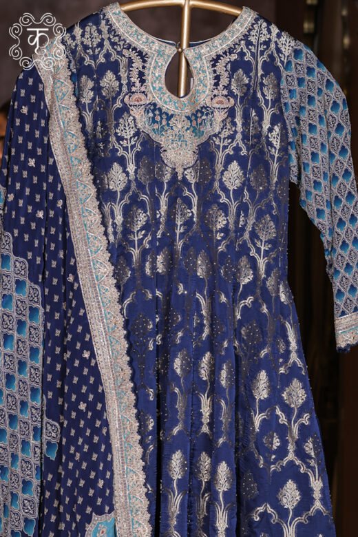 Elegant royal blue Anarkali suit featuring intricate floral embroidery