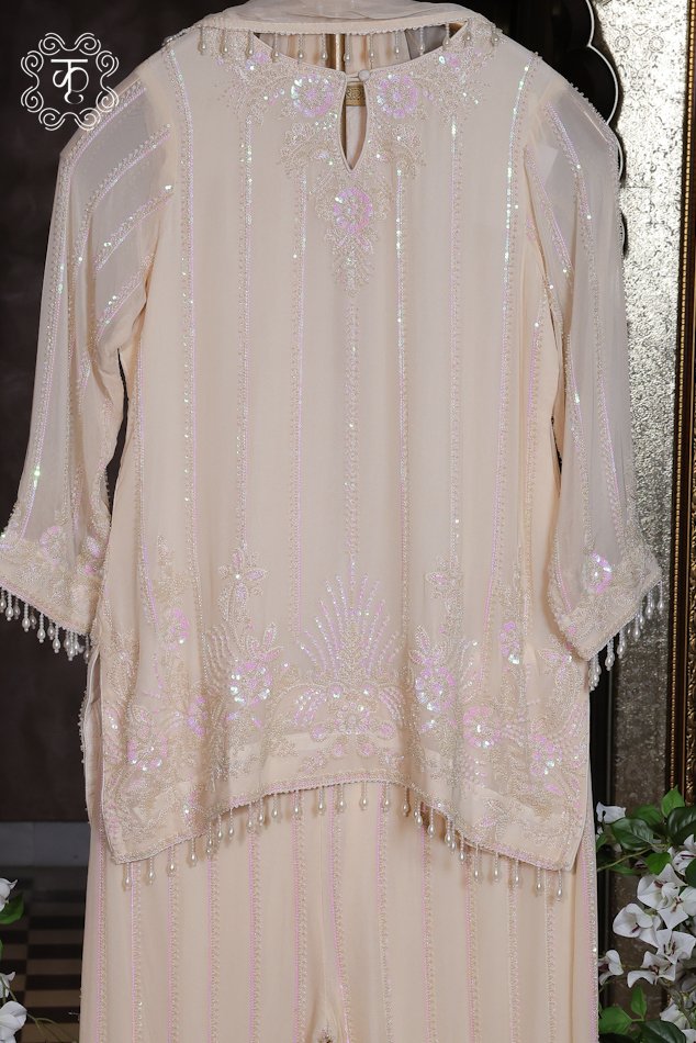 Designer ivory traditional suit with delicate sequin embroidery