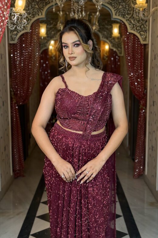 Designer wine contemporary draped saree with embellished blouse