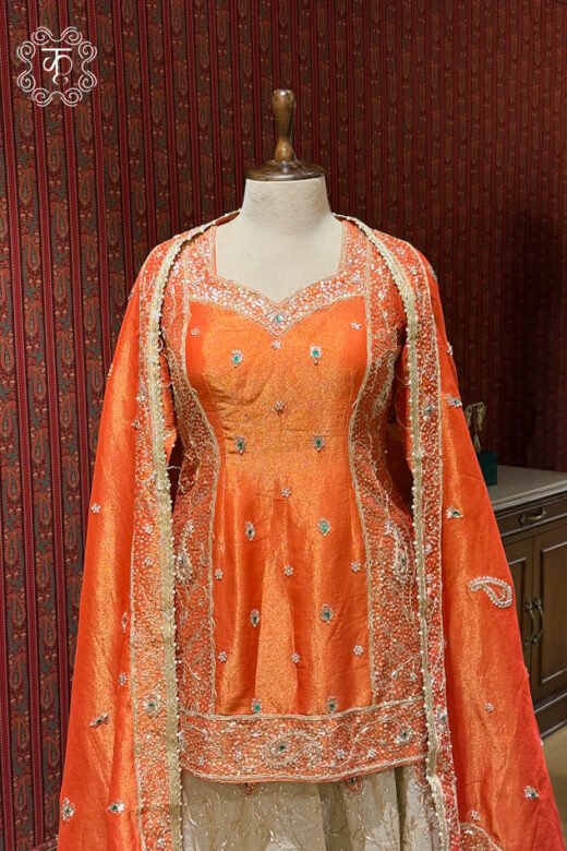 Coral orange embroidered designer sharara suit with matching dupatta