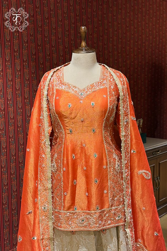 Coral orange embroidered designer sharara suit with matching dupatta