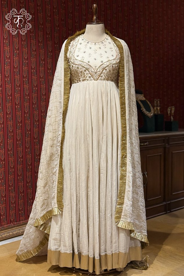 Elegant ivory designer Anarkali suit with gold zari embroidery