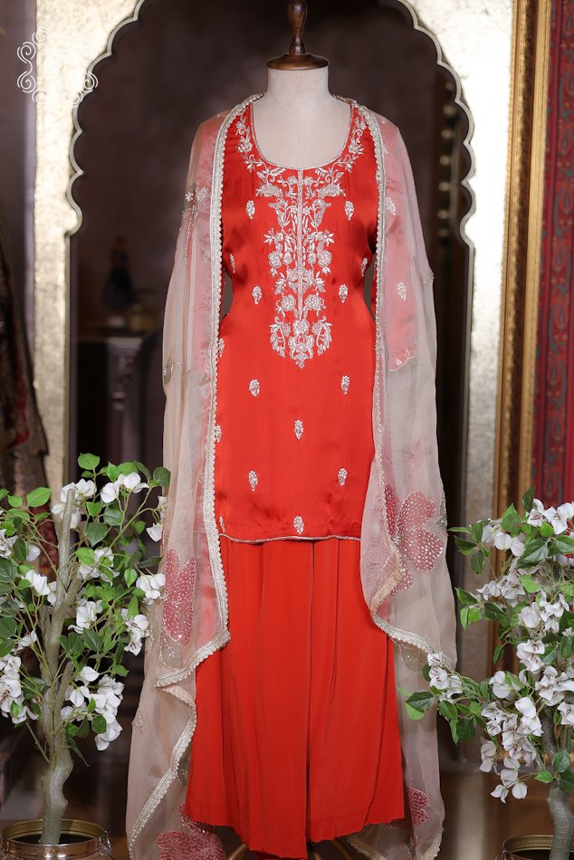 Rust orange hand embroidered designer sharara suit with organza dupatta