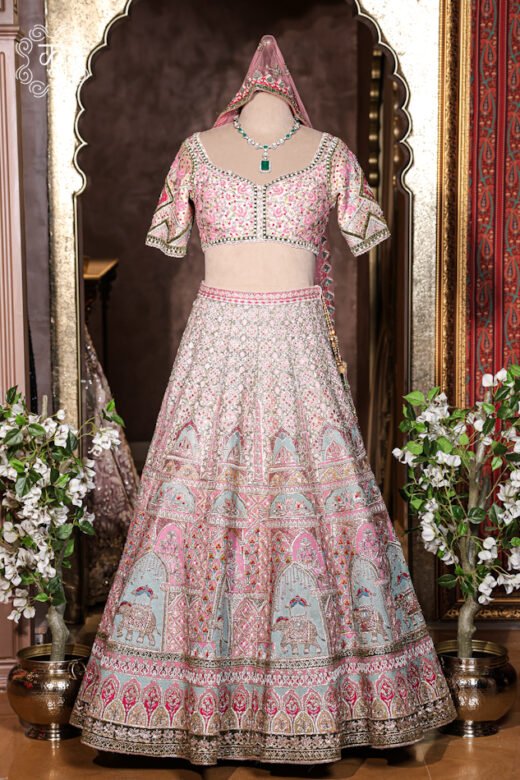 Hand Embroidered Heavy Bridal Lehenga Choli Set featuring a sweetheart-neck choli, elephant motif flared skirt, and embellished net dupatta from Kridhaa.