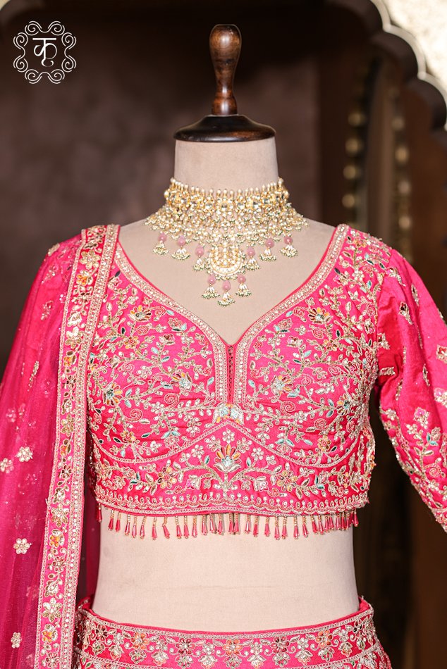 Close-up of the detailed palace archway motifs and scalloped hemline on the Hand Embroidered Heavy Bridal Lehenga Choli Set skirt.