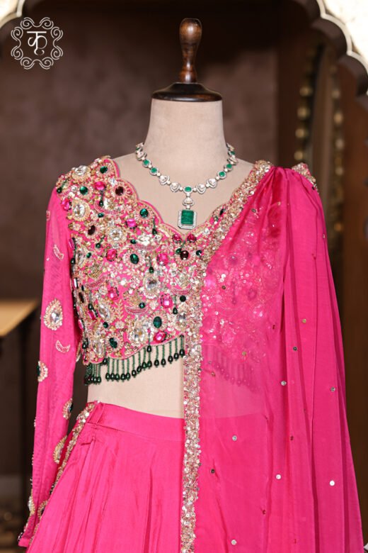 Hand Embroidered Stone Work Designer Lehenga Choli Set featuring a stone-embellished full-sleeve choli with beaded fringes, a voluminous flared skirt, and a draped net dupatta from Kridhaa.