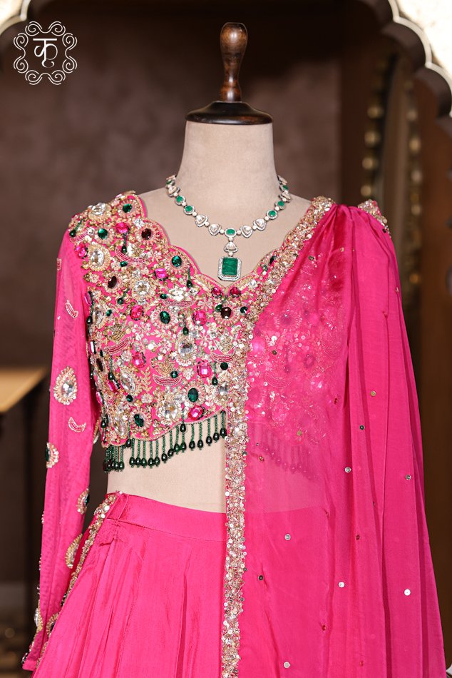 Hand Embroidered Stone Work Designer Lehenga Choli Set featuring a stone-embellished full-sleeve choli with beaded fringes, a voluminous flared skirt, and a draped net dupatta from Kridhaa.