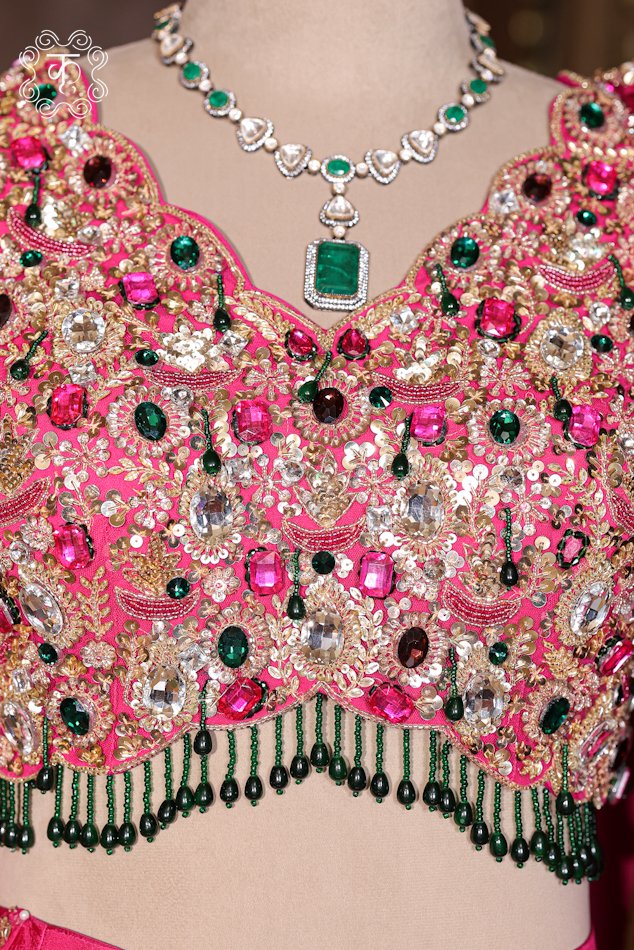 Close-up of the multi-colored stone embroidery and hanging beaded tassel fringes on the Hand Embroidered Stone Work Designer Lehenga Choli Set blouse.