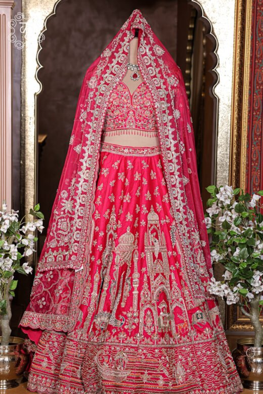 Detailed view of the hand-embroidered sweetheart neckline blouse with hanging bead fringe details from the Hand Embroidered Heavy Bridal Lehenga Choli Set.