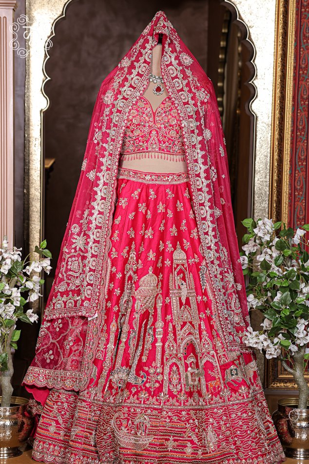 Detailed view of the hand-embroidered sweetheart neckline blouse with hanging bead fringe details from the Hand Embroidered Heavy Bridal Lehenga Choli Set.