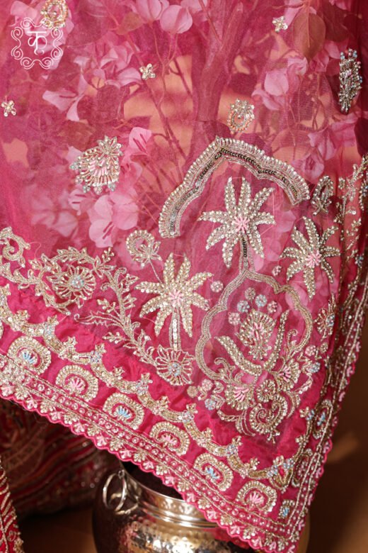 Detailed view of the embellished sheer net dupatta with finished embroidered borders from the Hand Embroidered Heavy Bridal Lehenga Choli Set.