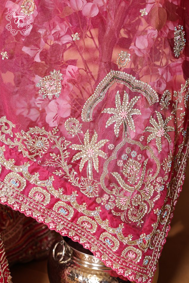 Detailed view of the embellished sheer net dupatta with finished embroidered borders from the Hand Embroidered Heavy Bridal Lehenga Choli Set.