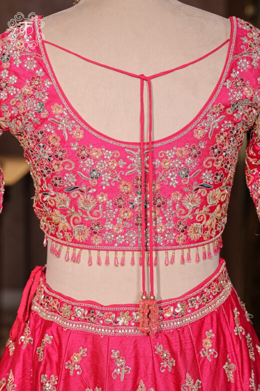 Close-up of the detailed architectural dome motifs and heavy zardozi border on the Hand Embroidered Heavy Bridal Lehenga Choli Set skirt.