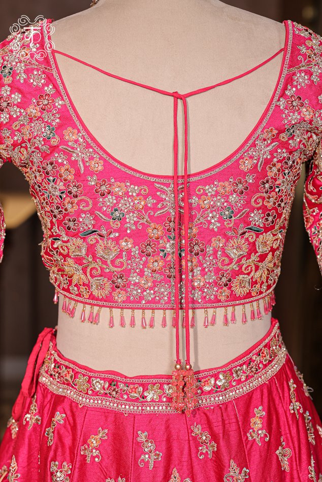 Close-up of the detailed architectural dome motifs and heavy zardozi border on the Hand Embroidered Heavy Bridal Lehenga Choli Set skirt.