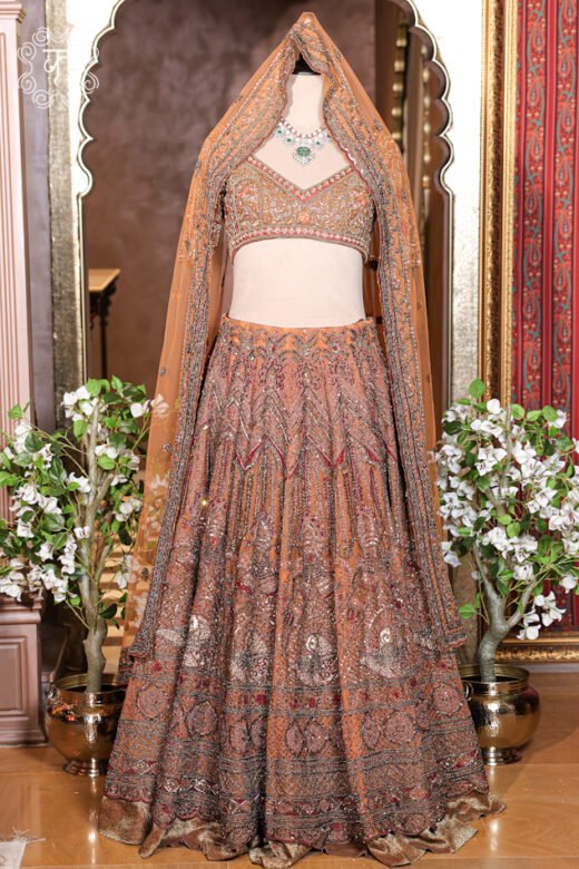 Detailed view of the embellished sheer net dupatta with finished embroidered borders from the Hand Embroidered Heavy Bridal Lehenga Choli Set.