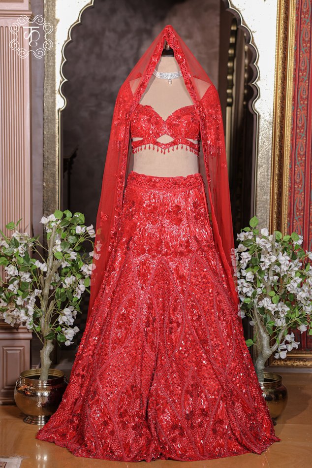 Hand Embroidered Sequin and 3D Floral Bridal Lehenga Choli Set featuring a sequined sweetheart choli with keyhole detail, a flared 3D floral motif skirt, and a sheer net dupatta from Kridhaa.