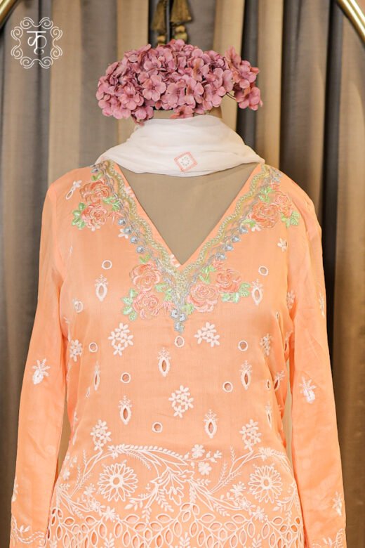 Complete silhouette of the Hand Embroidered Chikankari and Schiffli Cutwork Suit Set displaying the straight tunic and flared trousers from Kridhaa.