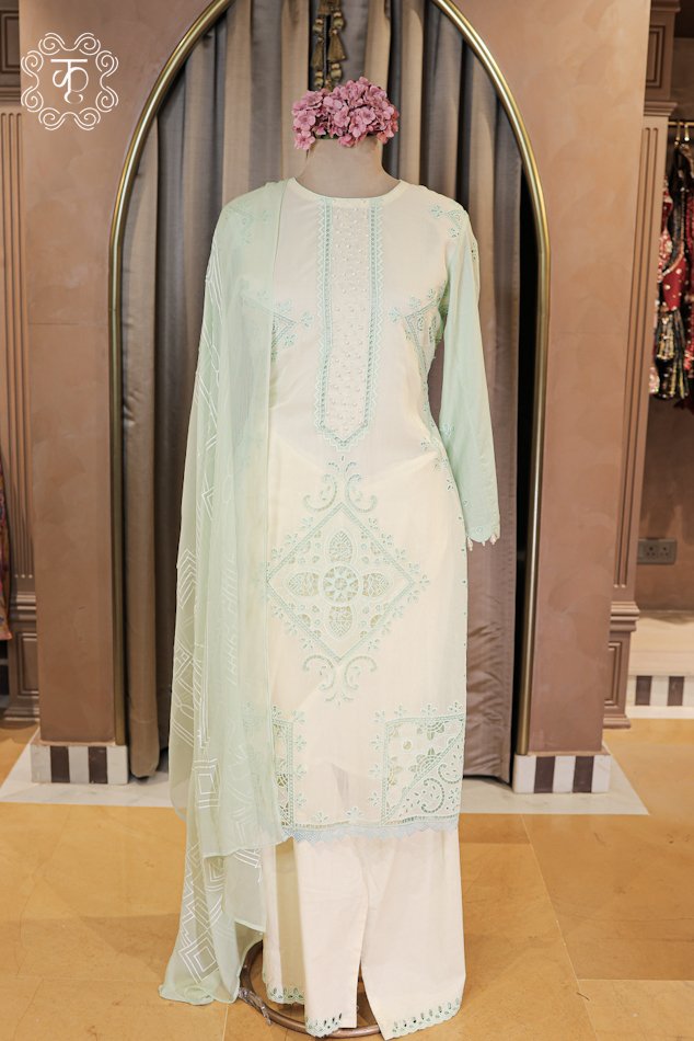 Embroidered Cutwork and Pearl Work Suit Set featuring a pearl embellished placket straight tunic, scalloped trousers, and printed dupatta from Kridhaa.