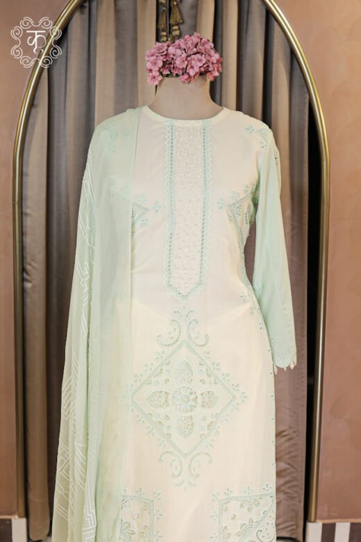 Detailed view of the scalloped cutwork hem on the trousers of the Embroidered Cutwork and Pearl Work Suit Set.
