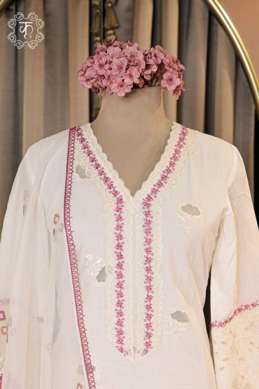 Hand Embroidered Floral V-Neck Chikankari and Schiffli Cutwork Suit Set featuring a floral V-neck tunic, schiffli cutwork sleeves, trousers, and floral printed dupatta from Kridhaa.