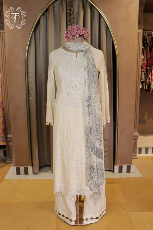 Embroidered Chikankari and Schiffli Cutwork Suit Set featuring a straight tunic with pearl trims, cutwork trousers, and printed dupatta from Kridhaa.