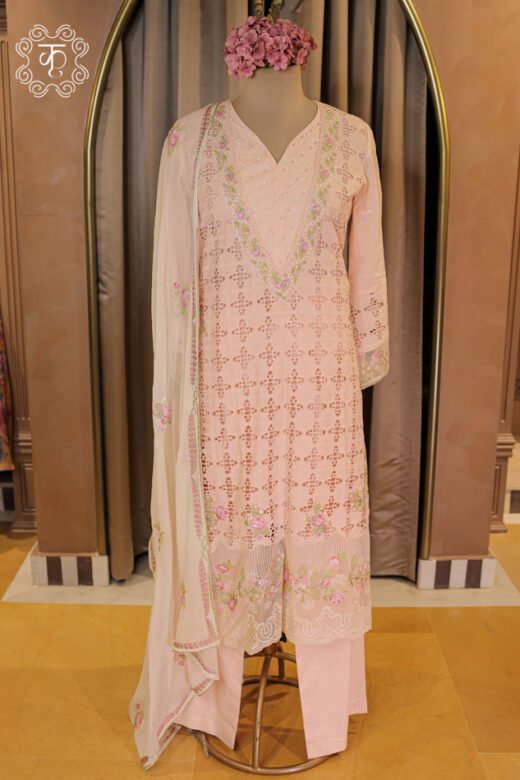 All-Over Schiffli Cutwork and Pearl Embellished V-Neck Suit Set featuring a cutwork tunic, embroidered scalloped hem, trousers, and dupatta from Kridhaa.