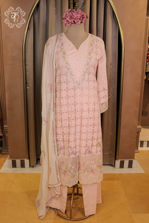 Close-up of the pearl embellishments and floral embroidery along the V-neckline of the All-Over Schiffli Cutwork and Pearl Embellished V-Neck Suit Set.
