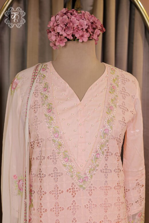 Detailed view of the floral embroidered sprigs and border trim on the dupatta of the All-Over Schiffli Cutwork and Pearl Embellished V-Neck Suit Set.