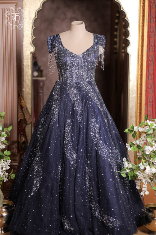 Close-up of the cap sleeve and dangling glass bead fringe tassels on the Crystal Sequined Sweetheart Corset Ball Gown.