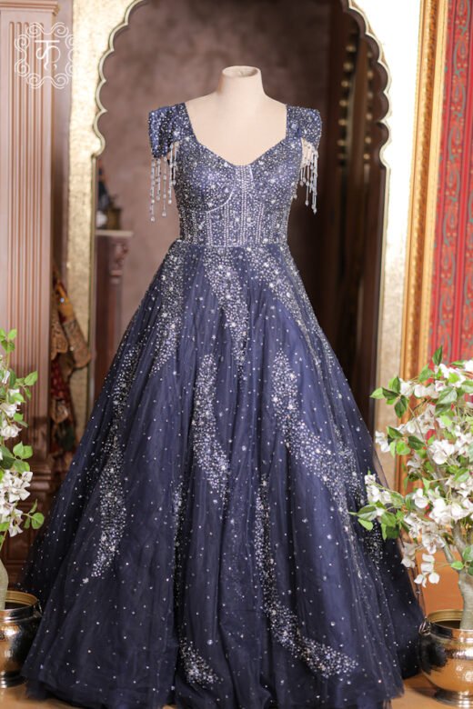 Crystal Sequined Sweetheart Corset Ball Gown featuring a crystal-embroidered corset bodice, dangling bead tassel cap sleeves, and a flared sequined skirt from Kridhaa.