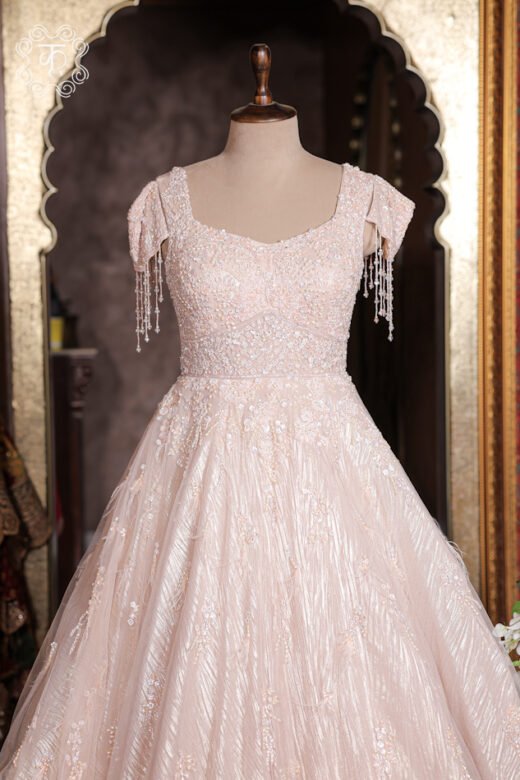 Embellished Sweetheart Corset Ball Gown featuring a crystal-embroidered bodice, dangling bead tassel cap sleeves, and a flared shimmer skirt from Kridhaa.
