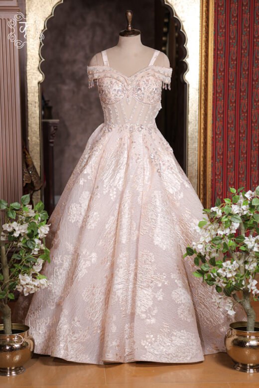 Detailed view of the crinkled shimmer tulle texture and embroidered floral sprays on the skirt of the Embellished Sweetheart Corset Ball Gown.
