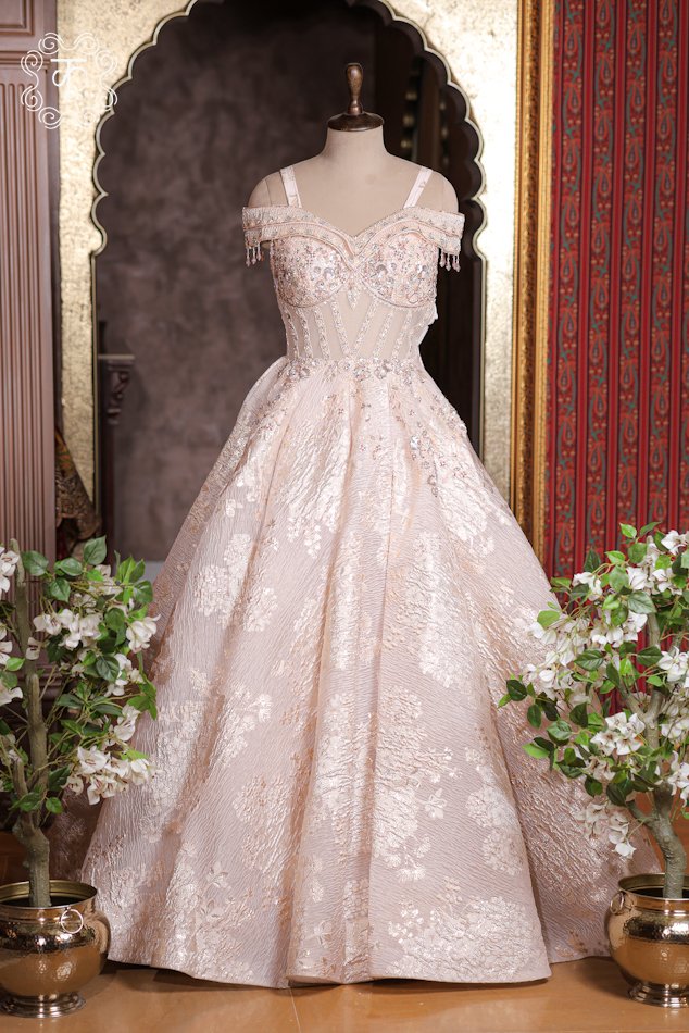 Embellished Sweetheart Corset Ball Gown featuring a crystal-embroidered bodice, dangling bead tassel cap sleeves, and a flared shimmer skirt from Kridhaa.