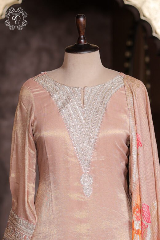 Detailed view of the floral print and multi-color striped hem on the flared sharara of the Embellished Zardozi Neck Tissue Silk Kurta Set.