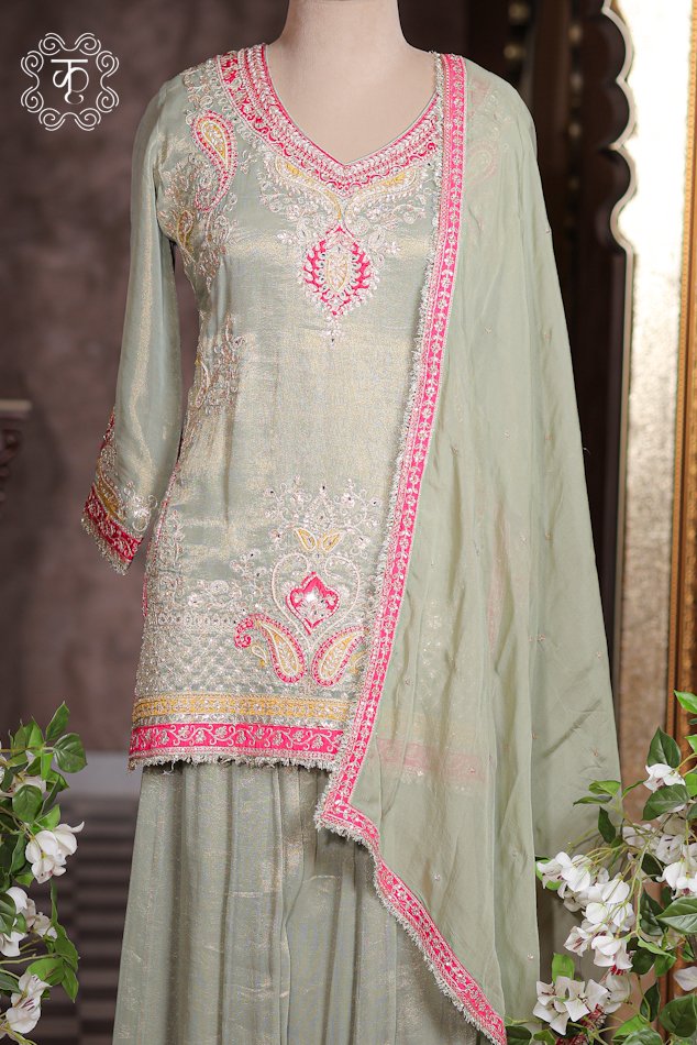 Close-up of the embroidered paisley motif and contrast border on the hem of the Embellished Paisley Zardozi Work Tissue Silk Short Kurta Sharara Set tunic.