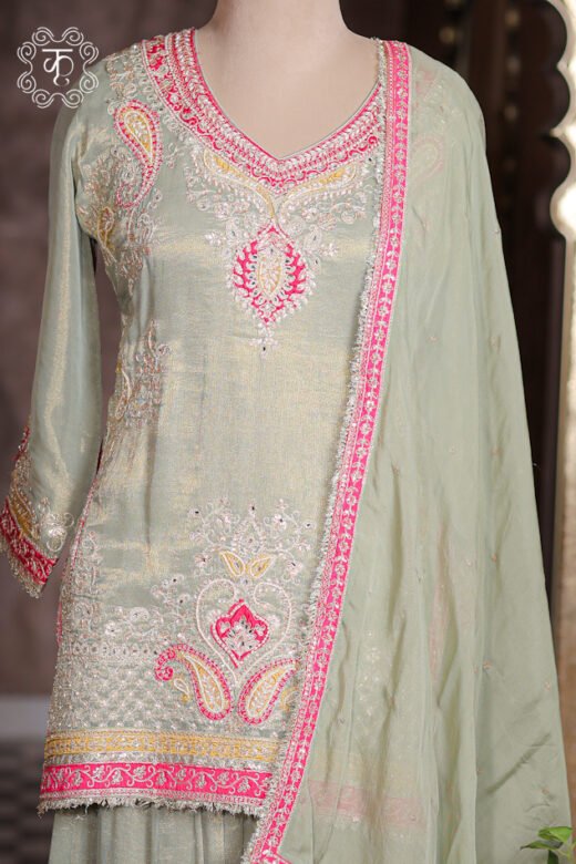 Complete silhouette of the Embellished Paisley Zardozi Work Tissue Silk Short Kurta Sharara Set displaying the tunic and wide sharara flare from Kridhaa.