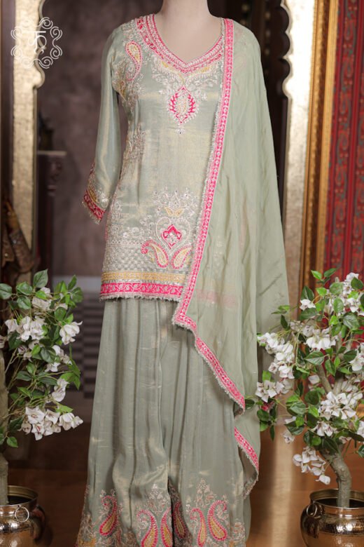 Detailed view of the embroidered paisley motifs and border on the flared sharara of the Embellished Paisley Zardozi Work Tissue Silk Short Kurta Sharara Set.