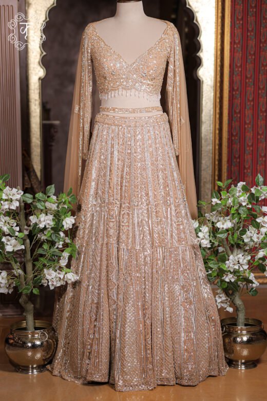 Detailed view of the tiered geometric chevron and lattice embroidery panels on the skirt of the Geometrical Embroidered Sweetheart Blouse Lehenga Set.