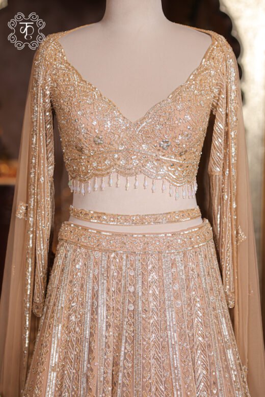 Close-up of the silver cutdana, sequin embroidery, and pearl bead fringe tassels on the sweetheart blouse of the Geometrical Embroidered Sweetheart Blouse Lehenga Set.