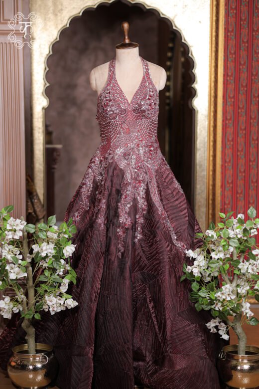 Close-up of the cascading crystal scroll embroidery flowing down the waist on the Halter-Neck Heavy Cutdana Embroidered Structured Texture Ball Gown.