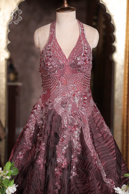 Close-up of the silver cutdana, sequin, and crystal embroidery on the halter neckline of the Halter-Neck Heavy Cutdana Embroidered Structured Texture Ball Gown.