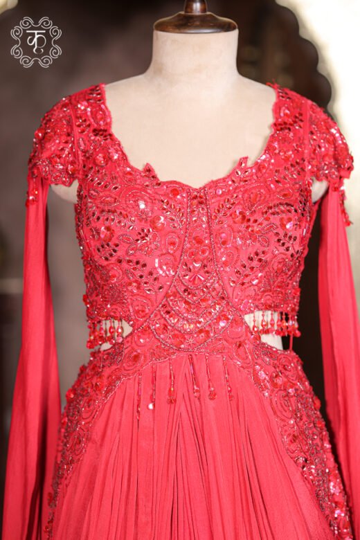Close-up of the side waist cut-out with dangling glass bead fringe drops on the Embellished Cut-Out Waist Pre-Draped Gown.