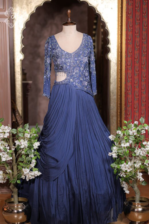 Close-up of the sequin, beadwork, and cutdana embroidery on the scoop neckline of the Sequined Cut-Out Waist Hand-Embroidered Pre-Draped Gown.