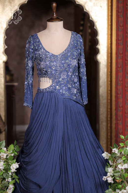 Sequined Cut-Out Waist Hand-Embroidered Pre-Draped Gown featuring a hand-embroidered bodice, side cut-out with crystal tassels, and pleated cowl skirt from Kridhaa.