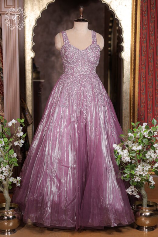 Detailed view of the crinkled metallic tissue weave and floral embroidery sprigs on the skirt of the Crystal Embroidered Sweetheart Corset Metallic Tissue Ball Gown.