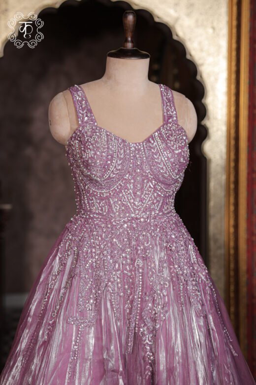 Close-up of the cascading crystal scroll embroidery and floral vines on the waist of the Crystal Embroidered Sweetheart Corset Metallic Tissue Ball Gown.