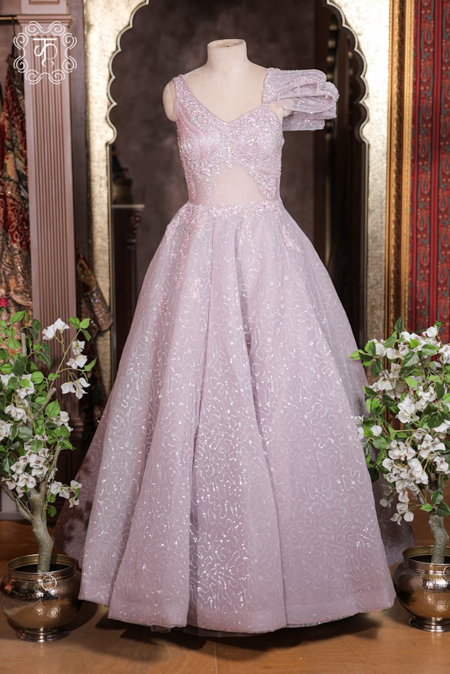 Embellished Sweetheart Corset Ball Gown featuring an illusion corset bodice, asymmetric one-shoulder ruffle sleeve, and a flared glitter skirt from Kridhaa.